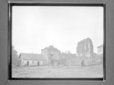 [C. Irving Fisher In Front Of Architectural Ruins]