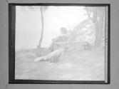 [Gertrude G., Laura M., And Clarence L. Fisher Resting By Outdoor Bench]