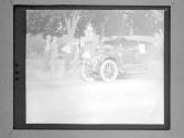 [People Looking At Automobile]