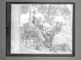 [Group Portrait, Gertrude G. Fisher With People (Garrison's) On Porch]