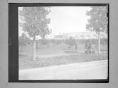 [Man And Woman In Front Of Arched Architecture]