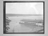 [Architectural Building Extending Into Marine View]
