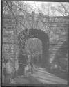 [Lamp Post Under Stone Archway]