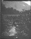 [Woman Under Bridge In Mountain Landscape]