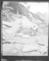 [Man And Woman On Rock Formation]