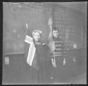 [Boy And Girl In Front Of Blackboard]