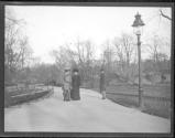 [People Walking Along Curved Walkway]