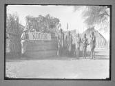 [George Eastman photographing natives in the village of Kodok along the White Nile in the Sudan.]