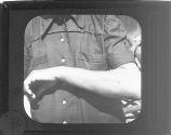 [Prisoner of war showing number tattooed on arm, Buchenwald Concentration Camp]