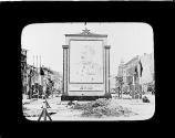 [War-stuck street with large portrait of Josef Stalin]