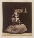 [Girl holding dove]