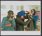 Students fit gas masks on their faces during a chemical warfare drill, in their school in the Bedouin town of Aroer, in preparation for a possible US-Irak war