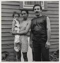 [Father in Lacoste shorts with wife and daughter, Buffalo, New York]