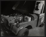 [New USPS DJ-5 jeep with it's hood open.]