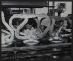 [A female worker on a production line]