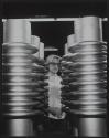 [Technician measuring a large metal industrial component]