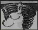[Technician assembling and adjusting aircraft engine component]