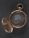 [Locket or pocket watch with portraits of man and woman]