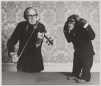 [Jack Benny playing the violin to a chimpanzee]