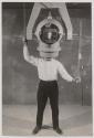 [Humorous image of a man with a piece of indusrial equipment as a head]