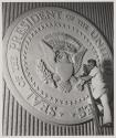 [Stone carver working on the great Seal of the United States]
