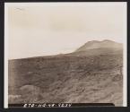 [View on firing range in United Kingdom showing camouflaged artillery command post and trucks. 21st FA BN, 5th Inf Div., near Annalong, County Down, No. Ireland.]