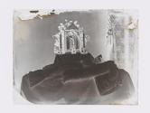 [Postmortem of child in front of altar]