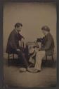 [Two men playing checkers]