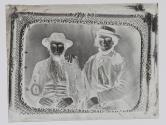 [Reproduction of a cased photograph of two men]