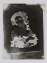 [Reproduction of an illustration of a woman with grapes]