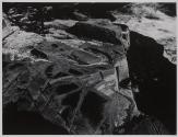 [Rocky cliffs at waterfront]