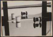 [Abstract study with spools of thread]