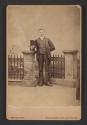 [Man holding top hat]