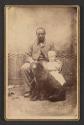[Man with child and dog]