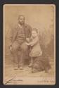 [Man with child and dog]