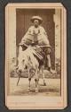 [Man on donkey]