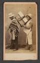 [Two Peruvian men carrying blocks]