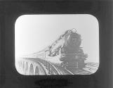 [Locomotive engine and train on bridge]