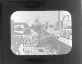 [Ocean liners unloading goods at dock]