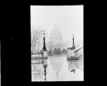 Rare view of Capitol in Rain. Reflections on Lib of Congress Portico