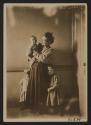 [Mother with three children in tenement]