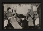 [Mother, grandmother, and three children in tenement]