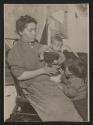 [Mother and two children in tenement]