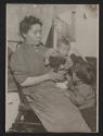 [Mother and two children in tenement]