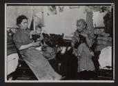 [Mother, grandmother, and three children in tenement]