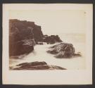 [Water and rocky coastline]