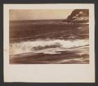 [Waves and rocky coastline]