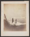 [Two people standing on ice floe]