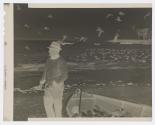 [Fisherman with boat full of fish]