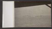 [Benson class destroyer escorting convoy of troop ships and freighters]